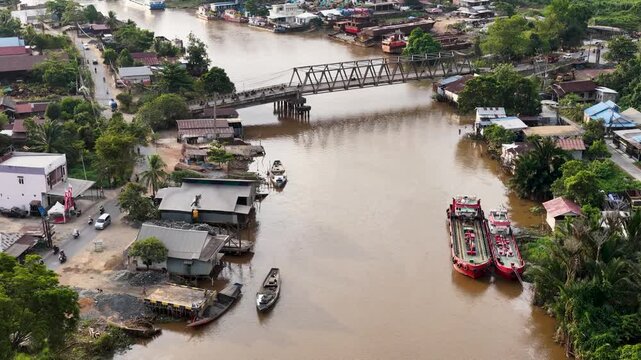 A view of Banjarmasin city and the Alalak River Bridge (or Basit Handil Bakti Bridge) in the late afternoon