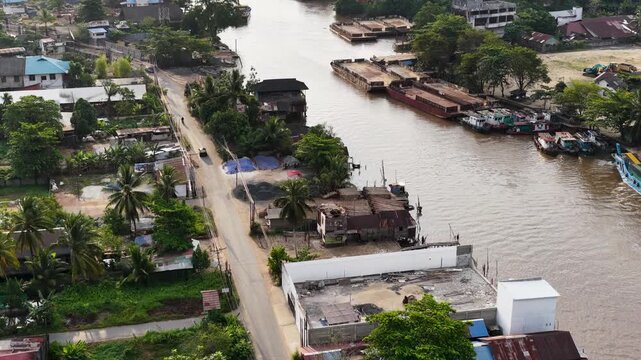 A view of Banjarmasin city and the Alalak River Bridge (or Basit Handil Bakti Bridge) in the late afternoon