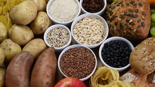 Carbohydrates food sources, top view, rotating