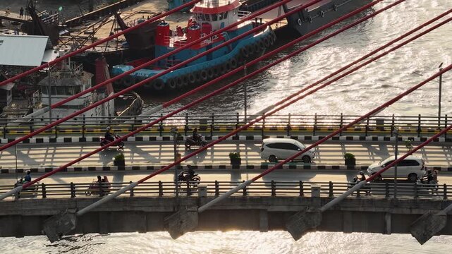 A view of Banjarmasin city and the Alalak River Bridge (or Basit Handil Bakti Bridge) in the late afternoon