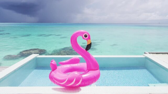 Funny vacation beach pool travel concept with inflatable pink flamingo float toy mattress in luxury swimming pool. Luxury lifestyle summer holidays travel background video. Real Raw Unedited video.