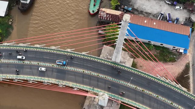 A view of Banjarmasin city and the Alalak River Bridge (or Basit Handil Bakti Bridge) in the late afternoon
