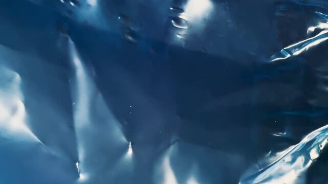 Shiny dark blue foil texture abstract metallic background