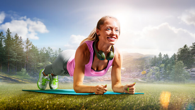Fitness. A fit girl doing fitness exercises outdoors. An athletic woman working out. Photo of an athletic fitness model working out with dumbbells outdoors.