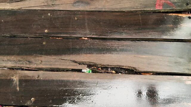 Wet weathered dark wooden planks texture background