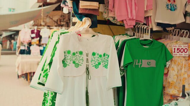Rack of Green and White Pakistan Themed Clothing Displayed at Market for 14 August
