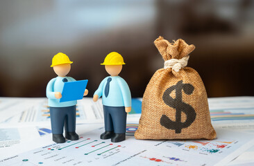 Obraz na płótnie Canvas Engineers with blue drawings and a dollar money bag. Design and engineering work. Infrastructure repair. Budget and construction.