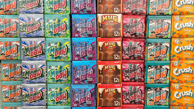 Mountain Dew, Mug Root Beer and Orange Crush soda pop display, all owned or distributed by PepsiCo.