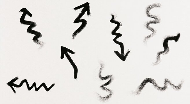 Collection of dark, abstract, wavy arrow shapes on a white background