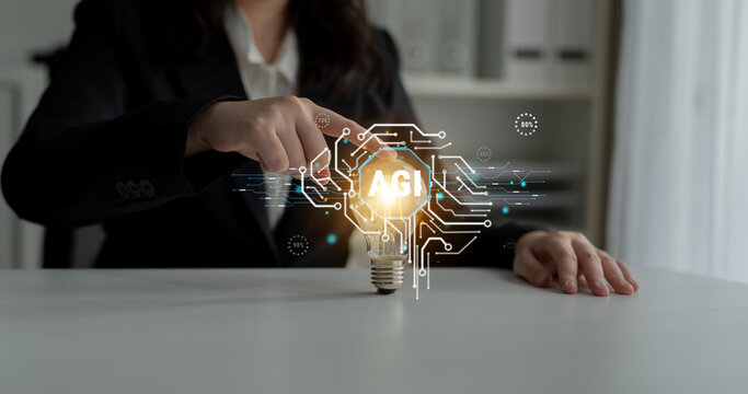 Innovative Concept of Artificial General Intelligence with a Light Bulb Symbolizing Ideas and Technology in a Modern Office Environment Haptic.