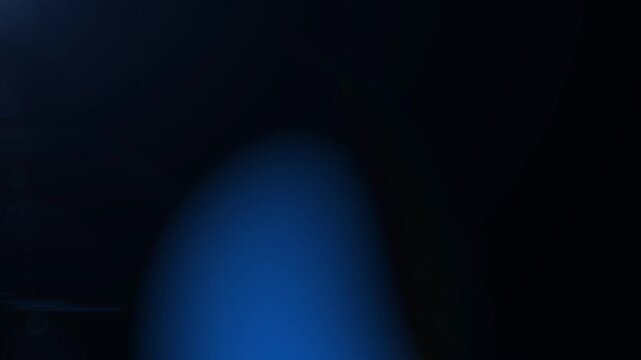 Bright blue lens flare transition with glowing light, soft gradients and optical reflections. Cinematic abstract background for video editing and visual effects. Alpha channel