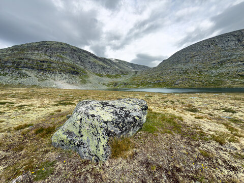 Mountain tarn in a rocky cirque in Dovrefjell National Park, Norway