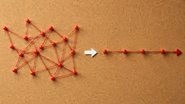 Complex problem solving concept with tangled red string transforming into straight line, representing business strategy and process optimization