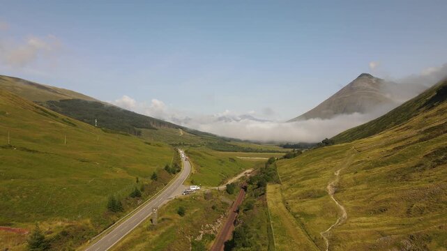 Aerial over the West Highland Way and the A82 below Beinn Dorain in Low Mist, Scotland