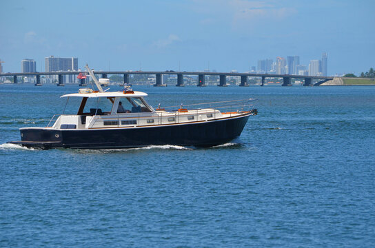 Vintage Motor Yacht on the Florida Intracoastal Waterway with the Julia Tuttle Causeway bridge in the background.