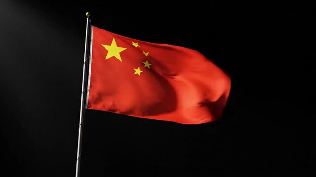 Chinese flag waving on flagpole in front of black background
