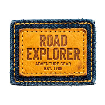 Denim patch with embossed leather label saying Road Explorer Adventure Gear Est 1985 PNG Isolated on transparent background