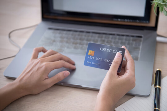 Online Shopping with Credit Card and Laptop for Secure Digital Payment