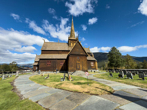 Lom stave church and its churchyard in summer, Norway