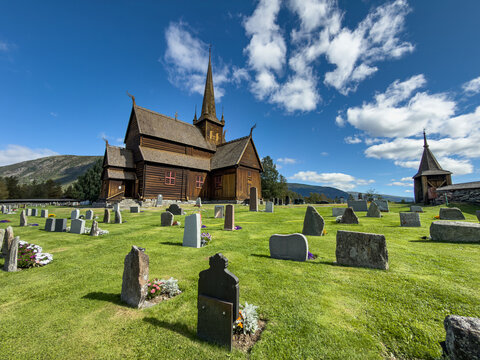 Lom stave church above its old graveyard, Innlandet, Norway