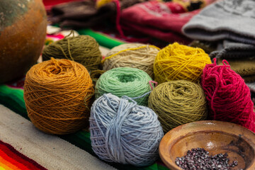 Colorful alpaca wool yarn used in traditional Andean textiles, Peru © Gino Tuesta