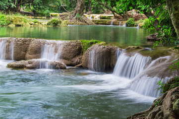Crystal clear cascading waterfalls in deep forest setting with waterfall landscape tropical outdoors wilderness ©  SobuzForge