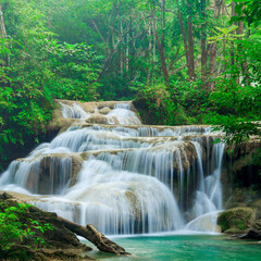Tiered waterfall in lush tropical forest with turquoise pool waterfall tropical landscape wilderness environment ©  SobuzForge