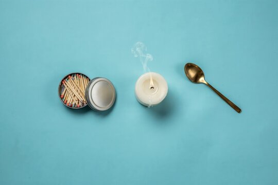 Vintage Dental Tools and Matches on Blue, Retro Medical Kit with Candle, Nostalgic Lightbox Composition, Flat Lay Background with Brass Spoon
