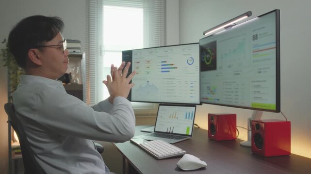 Asian Male Entrepreneur Financial manager Stretching after finish work database analysis worked. Entrepreneur business idea concept.