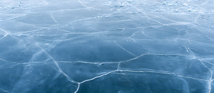 A backdrop depicting a frozen lake with icy textures and cracks, suitable for a copy space image.