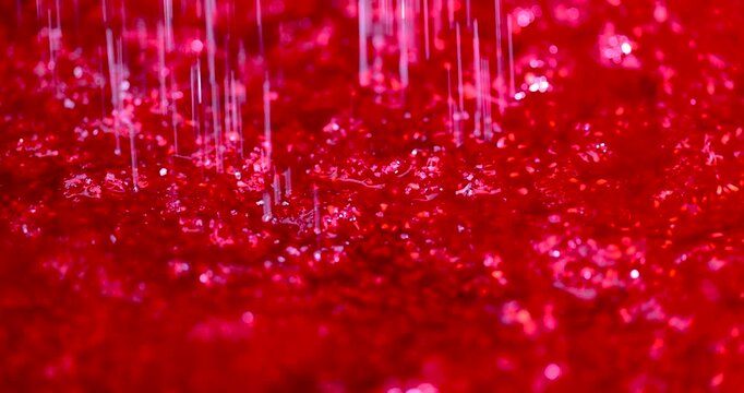 White granulated sugar is sprinkled on warm red grated raspberries, a portion of sugar is added to the mass of fresh raspberries for preservation