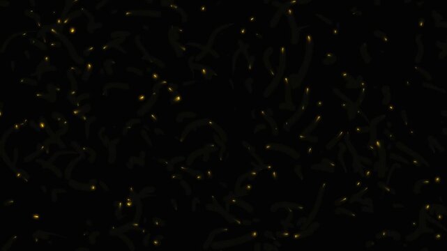 Abstract golden fire sparks flying on a black background