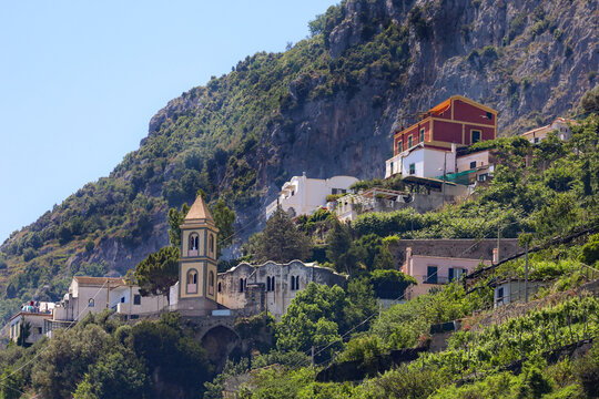 Amalfi Coast Village and Church with bell tower in Italy.