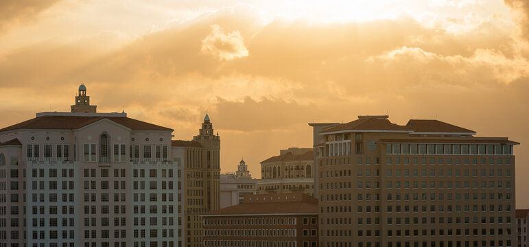 Historic Coral Gables Skyline Under Dramatic Golden Sunset Clouds in Florida