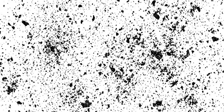 Abstract grunge texture in black and white with heavy ink splatter and distressed grain pattern