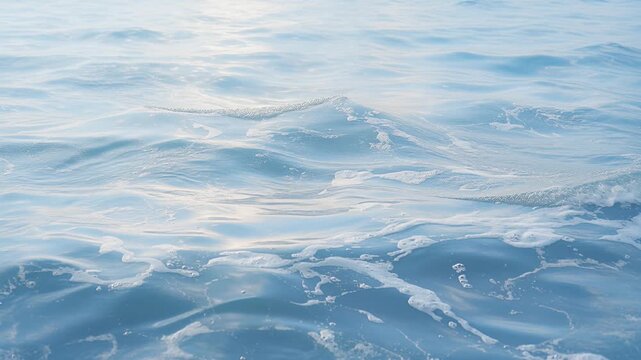 ocean waves on blue sea surface with sunlight reflections