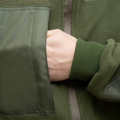 Hand in Pocket of Green Fleece Jacket © Алексей Божко