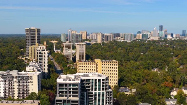 Aerial view of Buckhead uptown Atlanta city landscape with high corporate and residential buildings. Vital American business center and transportation artery.