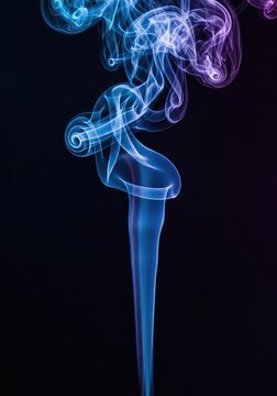 Vibrant abstract blue and purple colored smoke flowing and twisting mysteriously against a deep black backdrop, creating ethereal texture, mysterious, pattern, flow