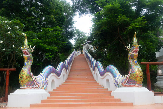 beautiful Naga staircase from a temple in the middle of a forest in Thailand