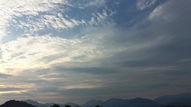 Minimal Mountain Silhouette with Glowing Clouds and Expansive Sky