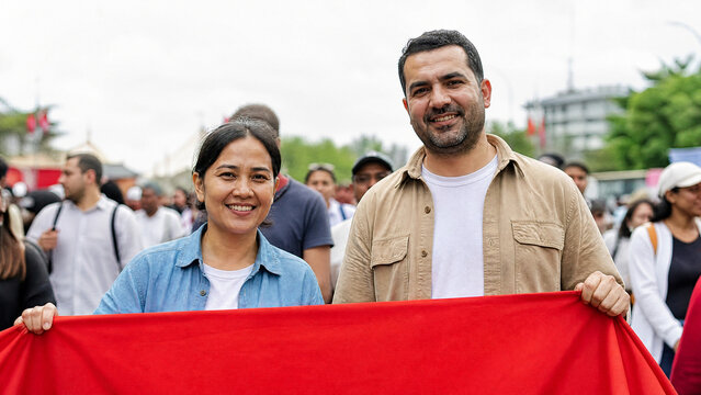 Diverse Community Celebrating Labor Day Parade with Red Banner