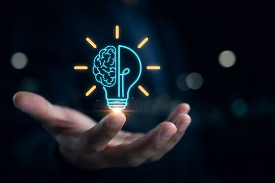 Human hand holding glowing lightbulb concept combining artificial intelligence and brain structure as creative idea.