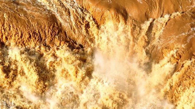 Aerial view of powerful flash flood water flow, illustrating extreme weather events, climate change impacts, disaster risk, water management challenges, and natural hazard awareness. Thailand. 4k.

