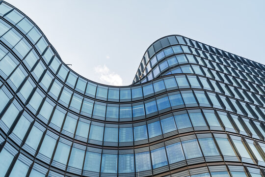 View of the modern glass facade of a building in the City of London, London, England, United Kingdom.