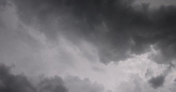 Dark storm clouds in overcast sky background, heavy grey rain cloud formation before thunderstorm in bad weather environment outdoors