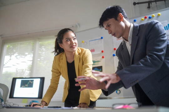 Business Colleagues Discussing Strategy in Office