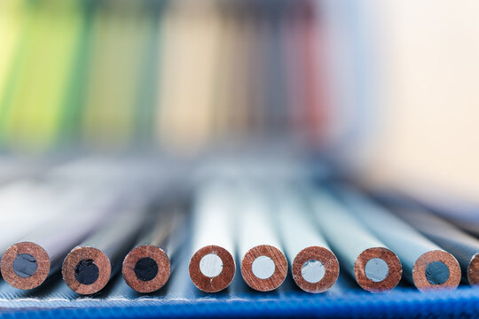colorful pencils lined up in pencil case with shallow depth of field