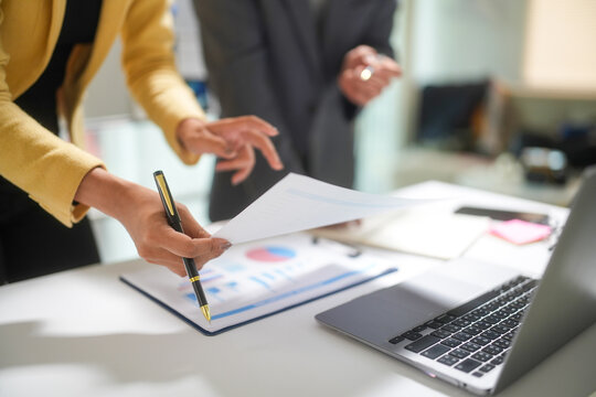 Business Team Reviewing Financial Reports in Office