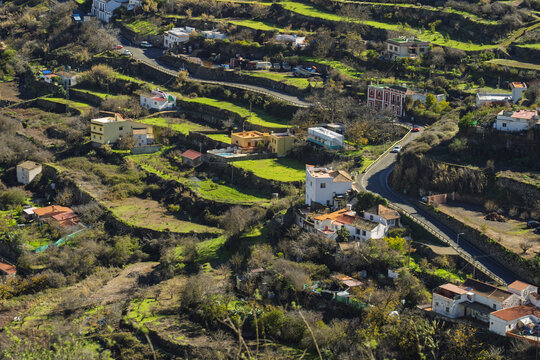 View of the terraced hillsides and traditional houses in the rural landscape of Vega de San Mateo, Canary Islands, Spain.